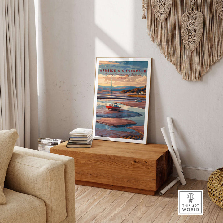 Arnside and Silverdale AONB travel print displayed in a cozy home setting with a boat and scenic landscape.