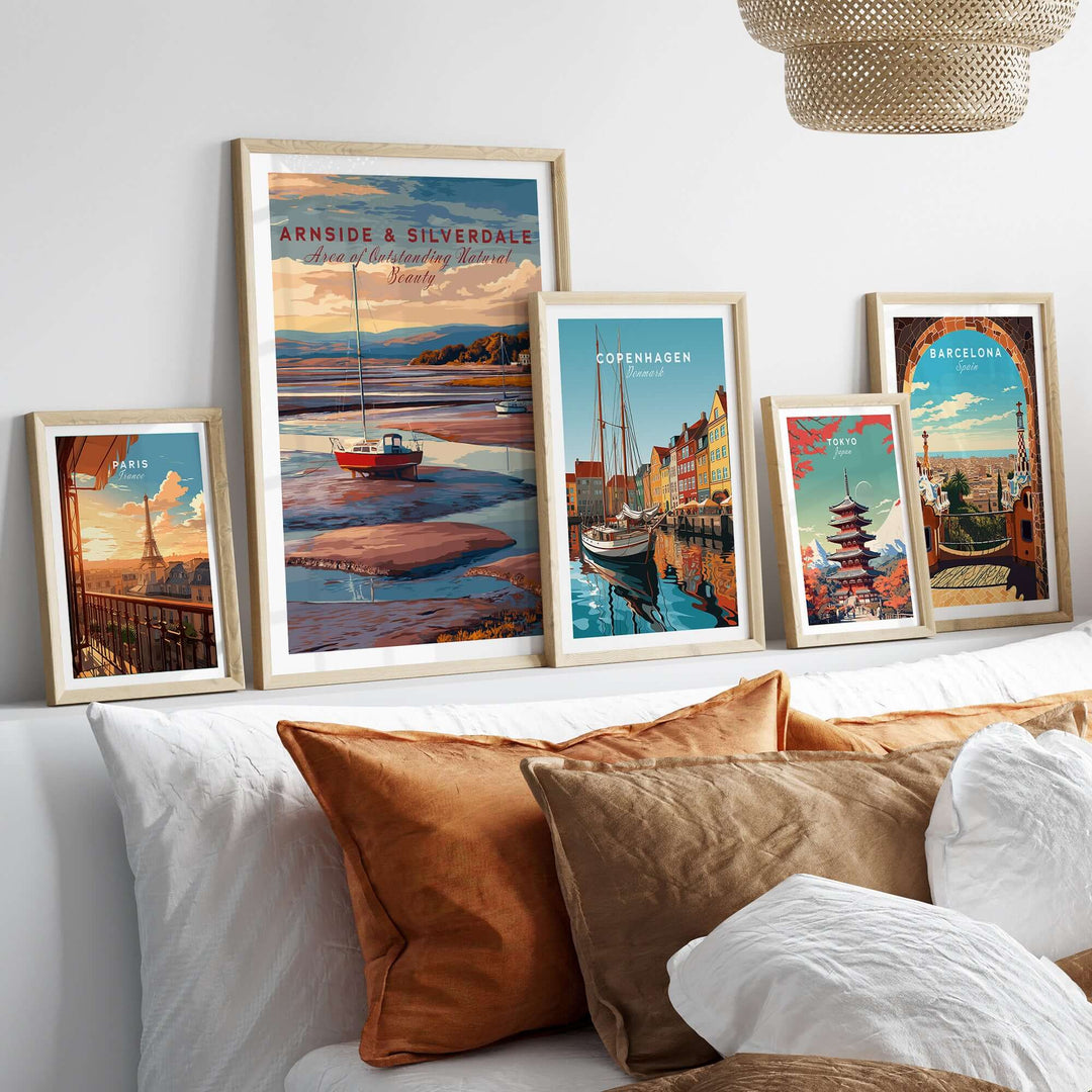 Framed Arnside and Silverdale travel print alongside other travel art in a cozy living room setting.