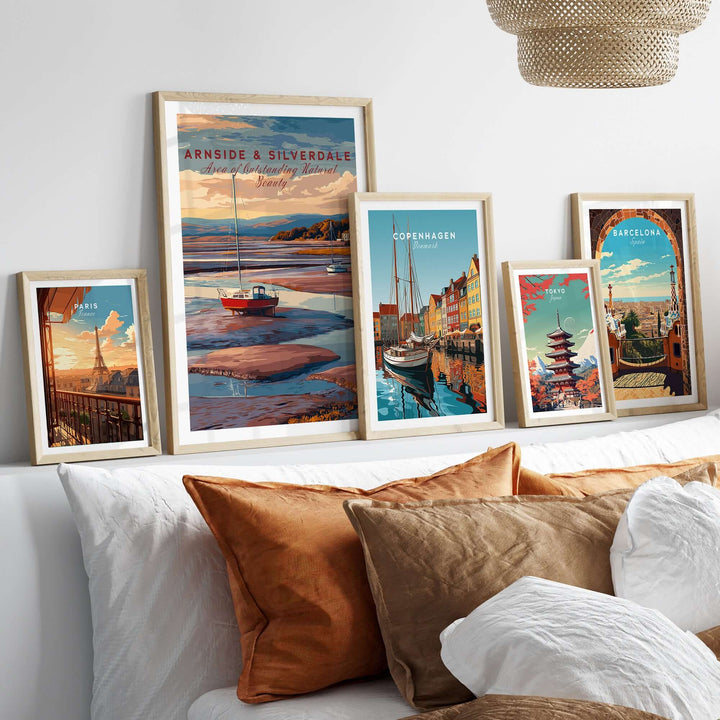 Framed Arnside and Silverdale travel print alongside other travel art in a cozy living room setting.