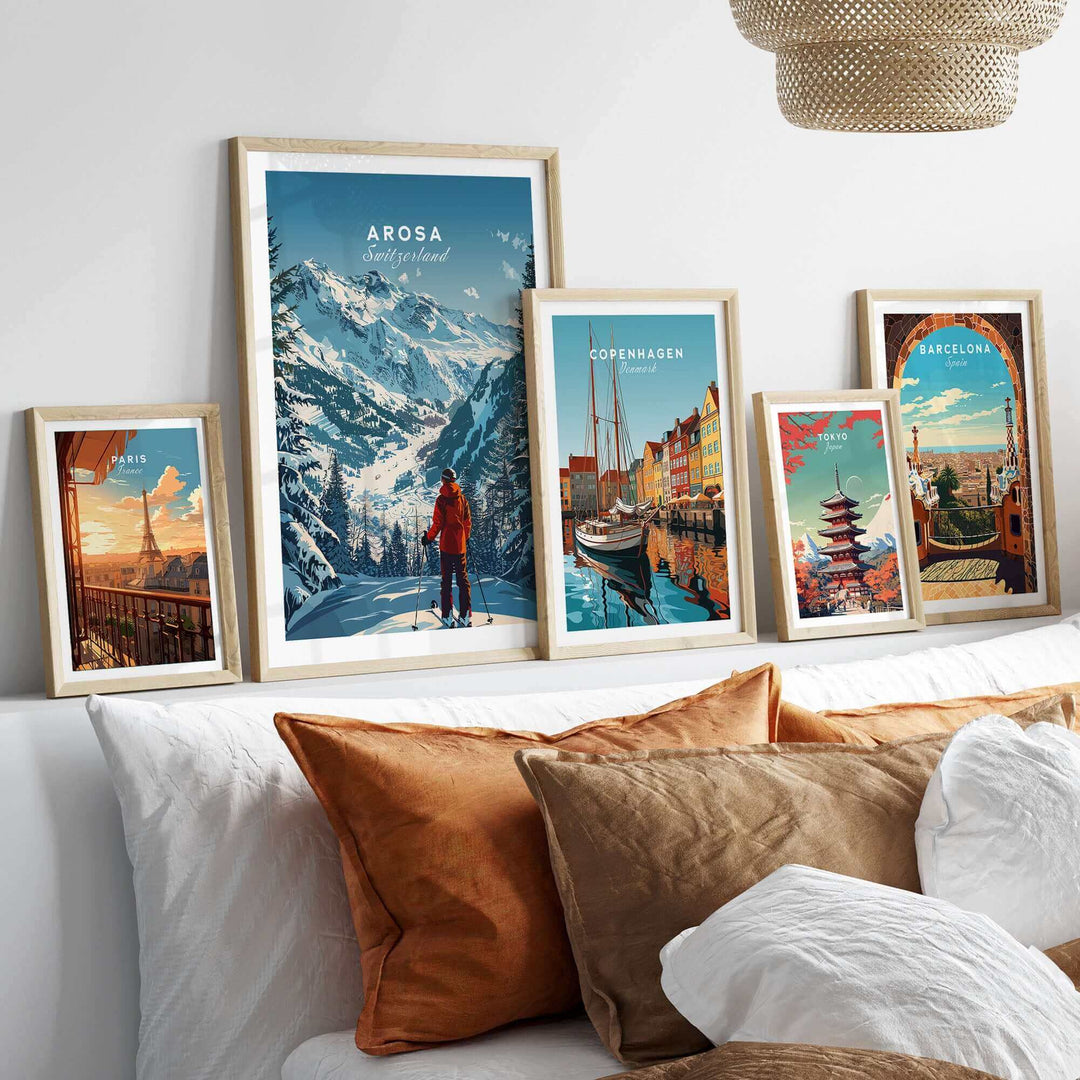 Arosa travel poster showcasing breathtaking Swiss landscapes, surrounded by framed city posters on a stylish couch.