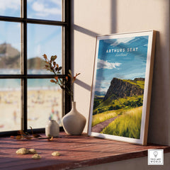 Arthurs Seat Scotland Travel Print displayed in a sunny room with a view of the iconic mountain and natural scenery.
