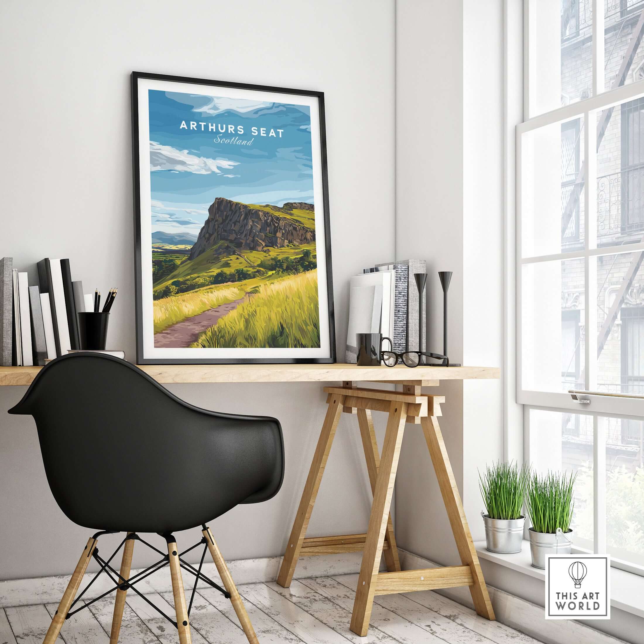 Arthurs Seat Scotland Travel Print framed on a modern desk, showcasing a scenic view of the iconic mountain.