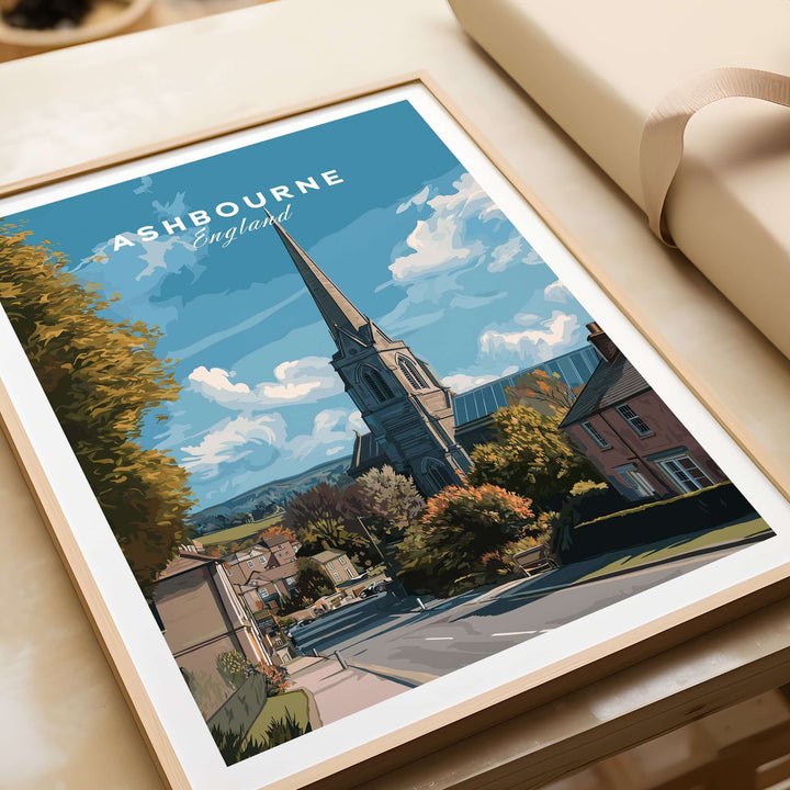 Ashbourne Art Print showcasing a serene English countryside view with a church and charming rural scenery.