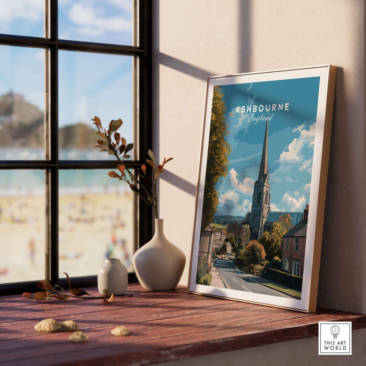 Ashbourne Art Print displayed on wooden table by the window, showcasing minimalist English countryside design.