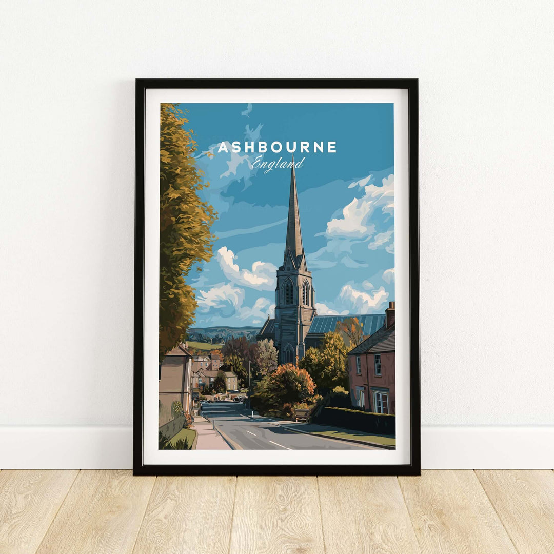 Ashbourne art print featuring a serene English countryside scene with a church steeple and blue sky.