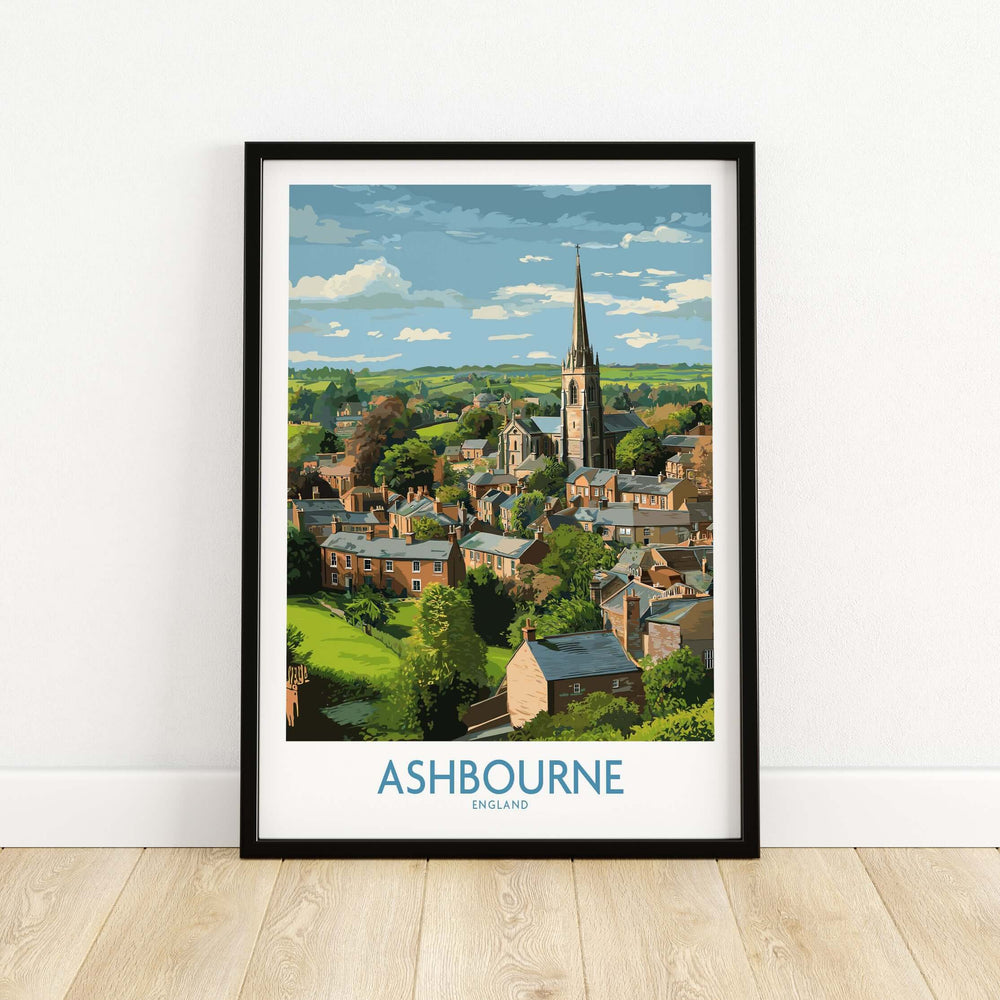Framed Ashbourne poster showcasing Derbyshire landscape with rolling hills and charming English village scene.