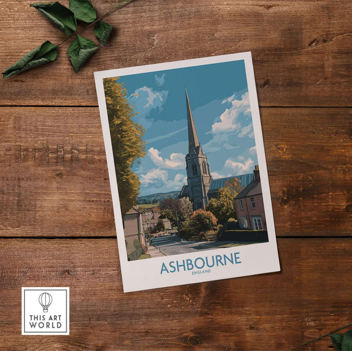 Ashbourne poster showcasing a church and village scene, capturing Derbyshire's charm in a travel print.