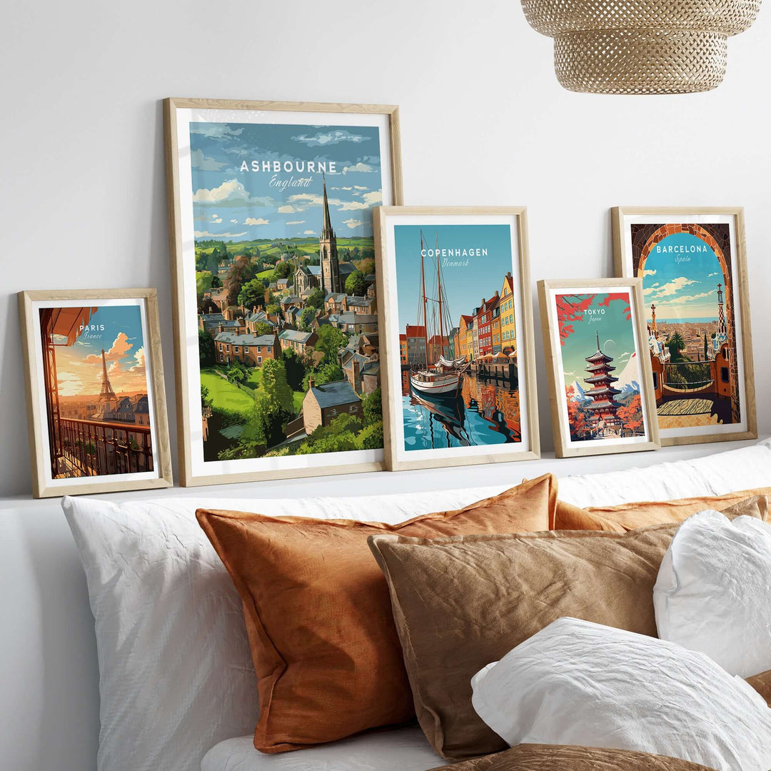 Framed Ashbourne Print alongside travel posters of Copenhagen and Barcelona, showcasing rural and urban landscapes.