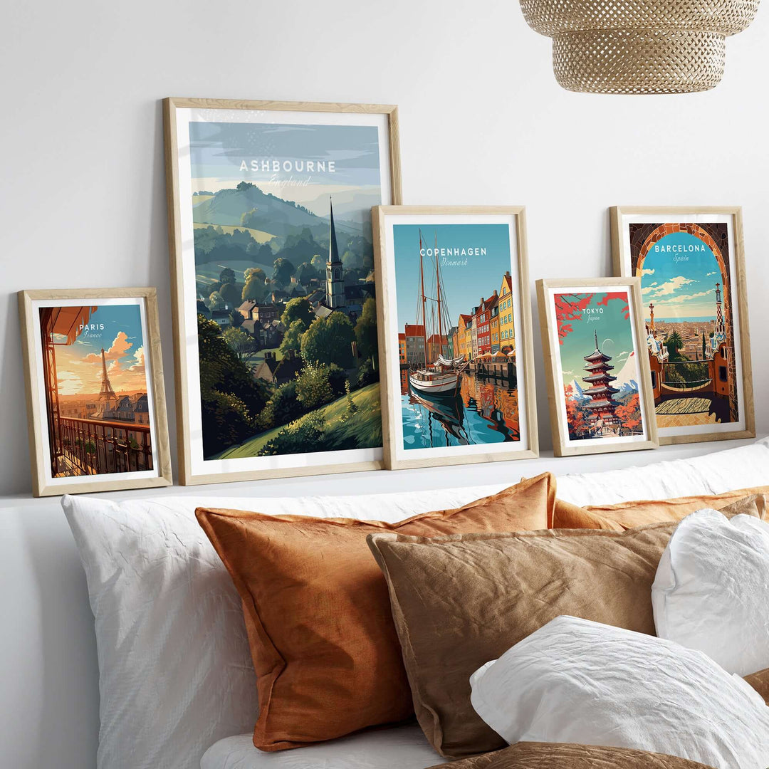 Gallery wall display featuring Ashbourne St Oswald's wall art and travel prints from Copenhagen and Barcelona.