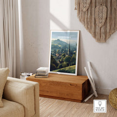 Ashbourne St Oswald's Wall Art - Rural England Print - Peaceful Village Poster displayed in a cozy living room setting.