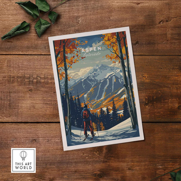 Aspen Print Ski Poster on wooden floor, showcasing vibrant mountain scenery and skier, perfect for ski enthusiasts and home decor.