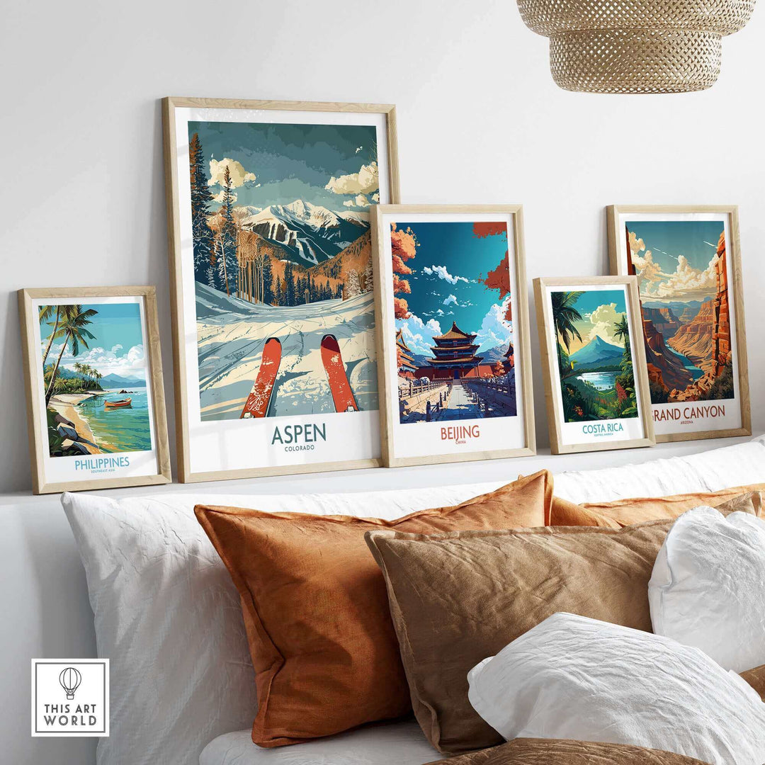 Framed travel posters featuring Aspen, Beijing, Costa Rica, and the Grand Canyon displayed in a cozy interior setting.