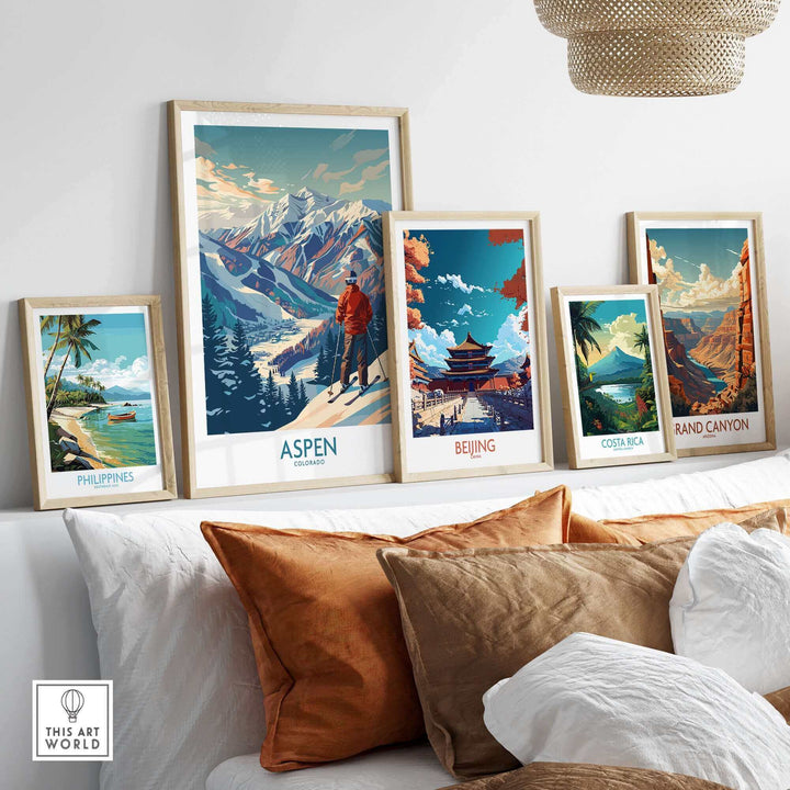 Collection of framed wall art featuring Aspen Ski Poster, Beijing, Philippines, Costa Rica, and Grand Canyon designs on shelves.