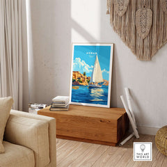 Aswan Print Egypt artwork displayed in a bright living room with a sailboat and vibrant colors.
