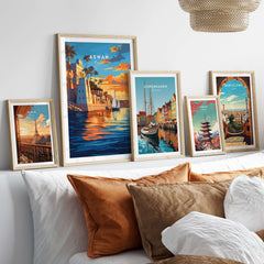 Aswan Travel Print displayed among travel posters, showcasing vibrant scenes of Aswan and other cities in an elegant home setting.
