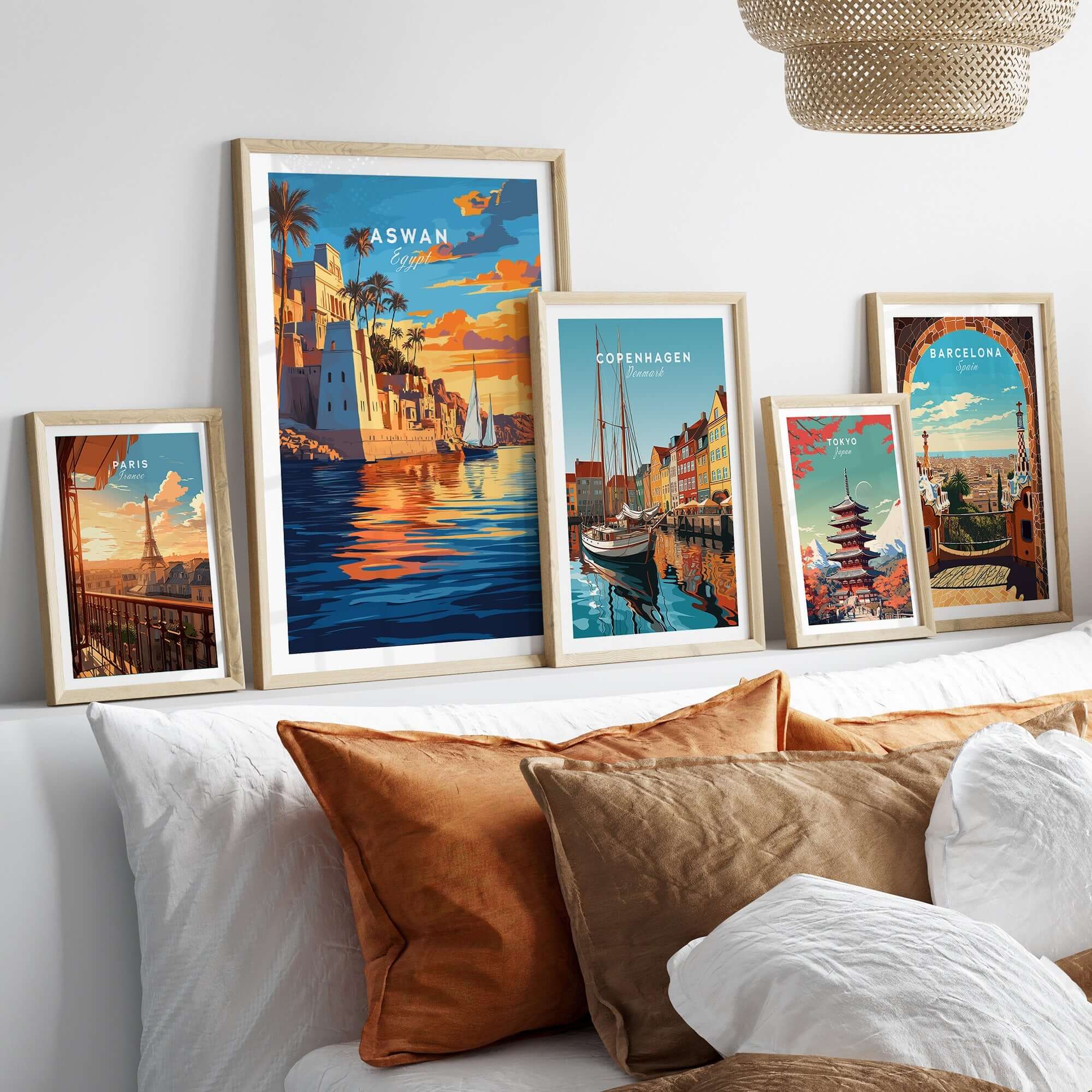 Aswan Travel Print displayed among travel posters, showcasing vibrant scenes of Aswan and other cities in an elegant home setting.