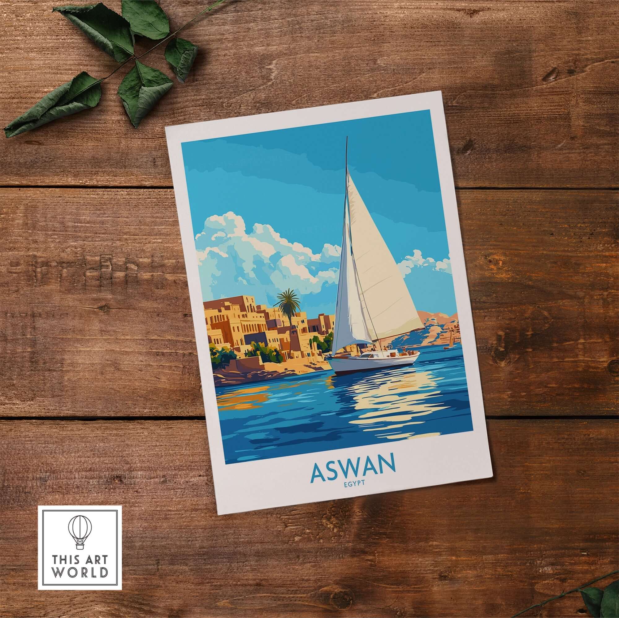 Aswan Wall Art Print featuring a vibrant scene of a sailboat on the Nile with colorful buildings in Aswan, Egypt.