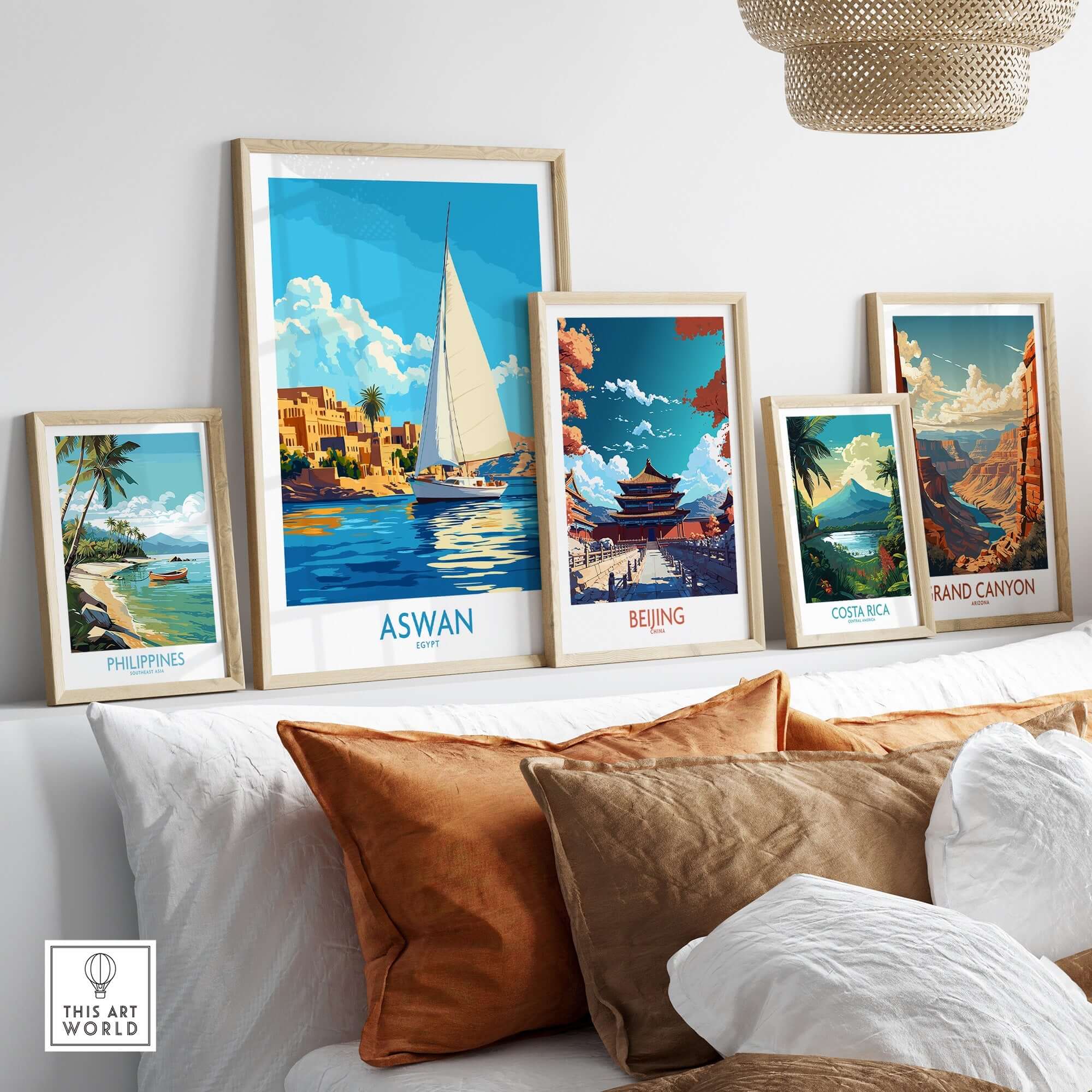 Aswan Wall Art Print displayed among other travel posters on a styled shelf in a modern living room.