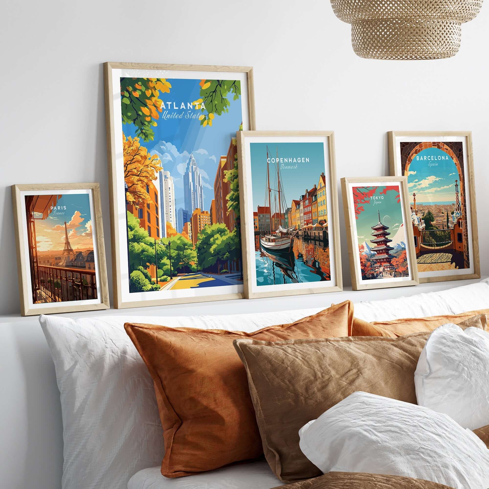 Atlanta Wall Art displayed among other city-themed artwork on a cozy couch, enhancing urban charm.