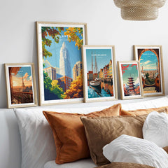 Atlanta Wall Art Poster displayed among framed city posters on a stylish bed with decorative pillows.