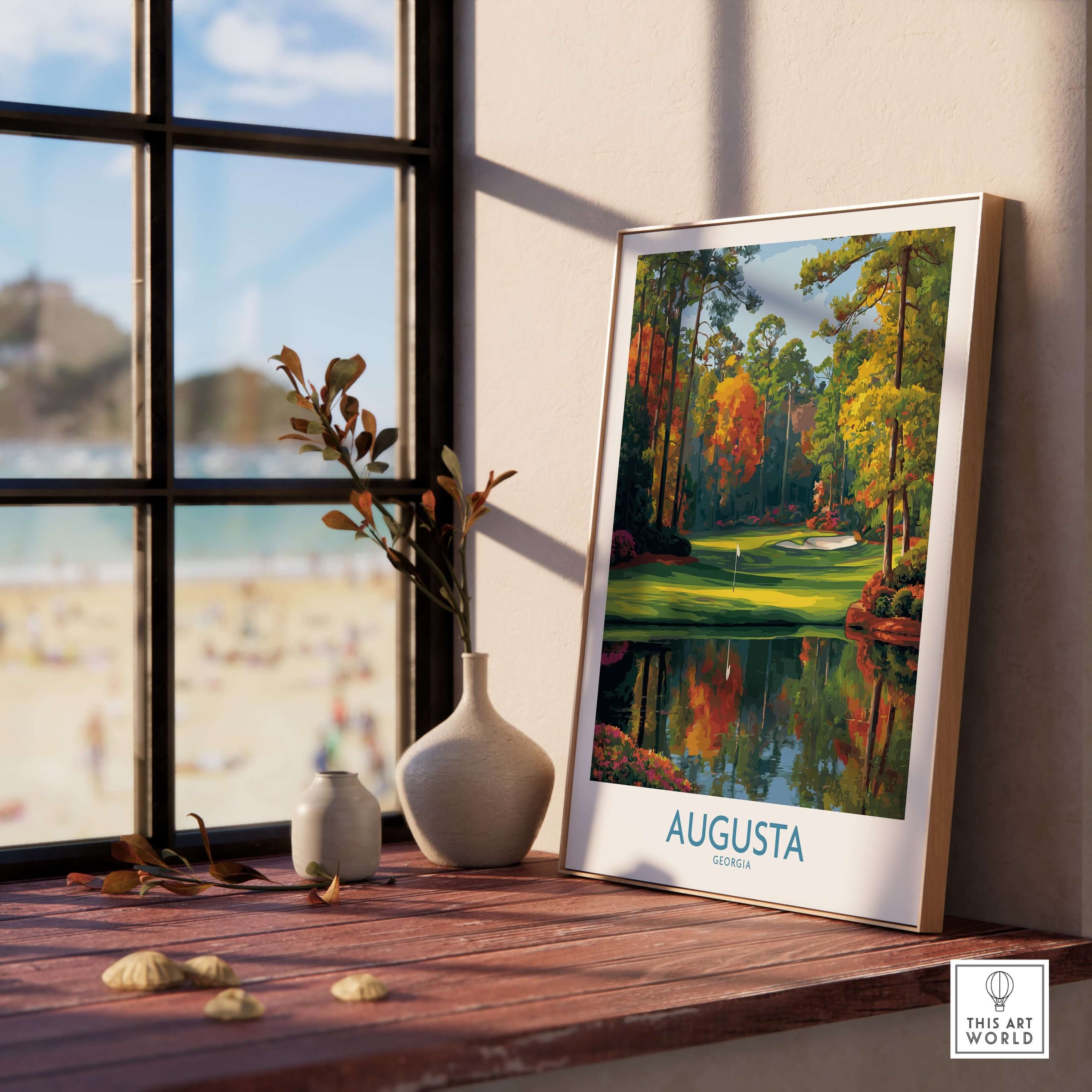 Augusta The Masters Golf Wall Art Print displayed by a window with beach view, featuring the iconic Augusta landscape.
