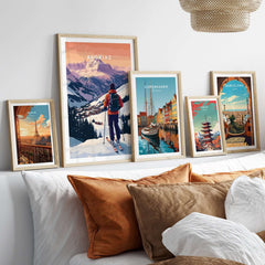 Avoriaz French Ski Poster | Skiing Wall Art showcased among travel-themed posters on a stylish sofa.