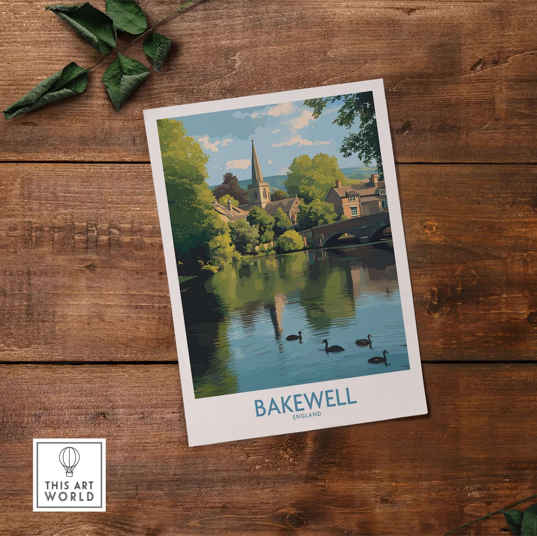 Bakewell Poster - River Wye - Derbyshire Peak District Print - English Village Travel Art - A4 A3 A2 displayed on wooden surface.