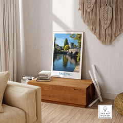 Bakewell Poster - River Wye Wall Art - Derbyshire Village Print - UK Travel Decor displayed in a cozy living room setting.