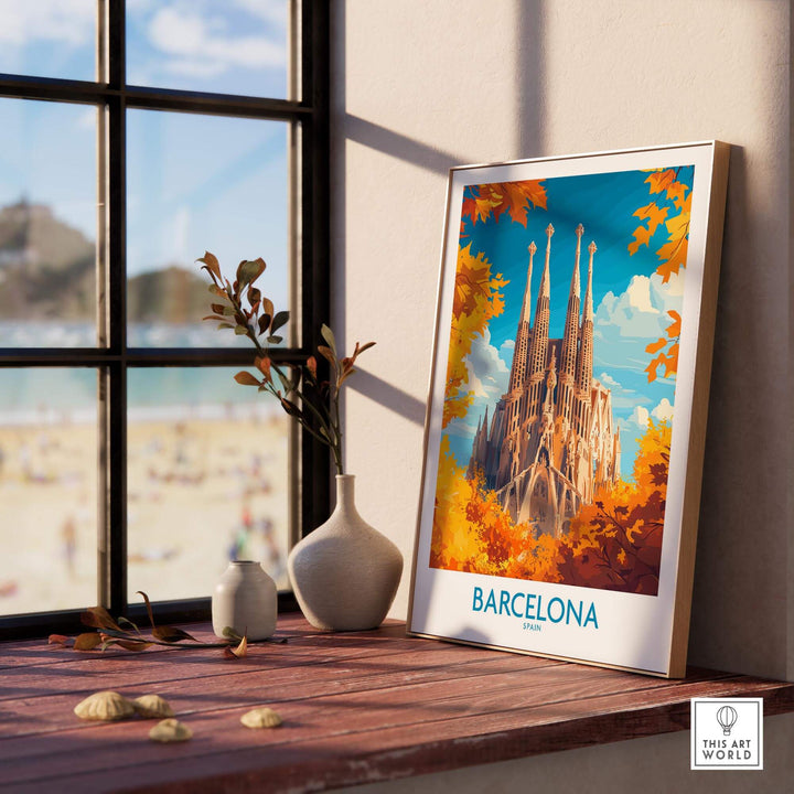 Barcelona travel poster featuring Sagrada Familia, displayed by a window with a beach view and decorative elements.