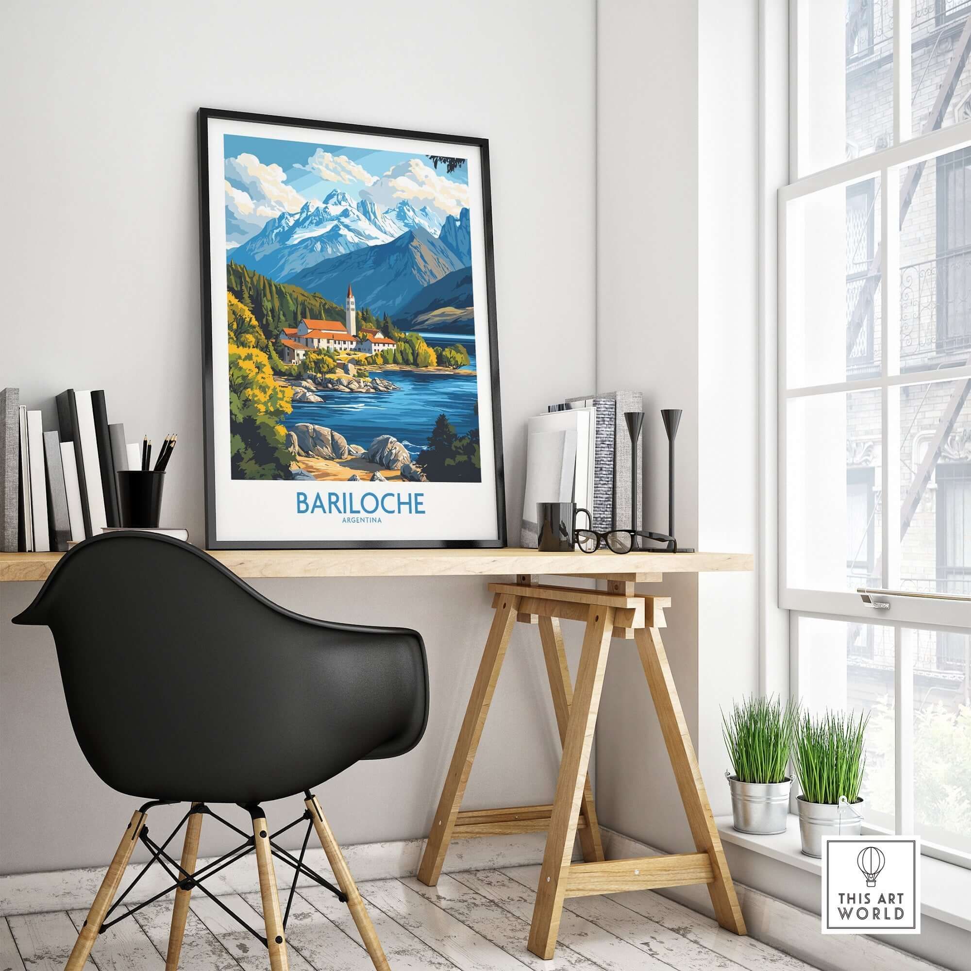 Bariloche Poster displayed in a stylish office setting, showcasing stunning mountain and lake scenery.