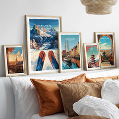 Bariloche Print Argentina showcased among other destination prints on a cozy sofa, highlighting adventure and beauty.
