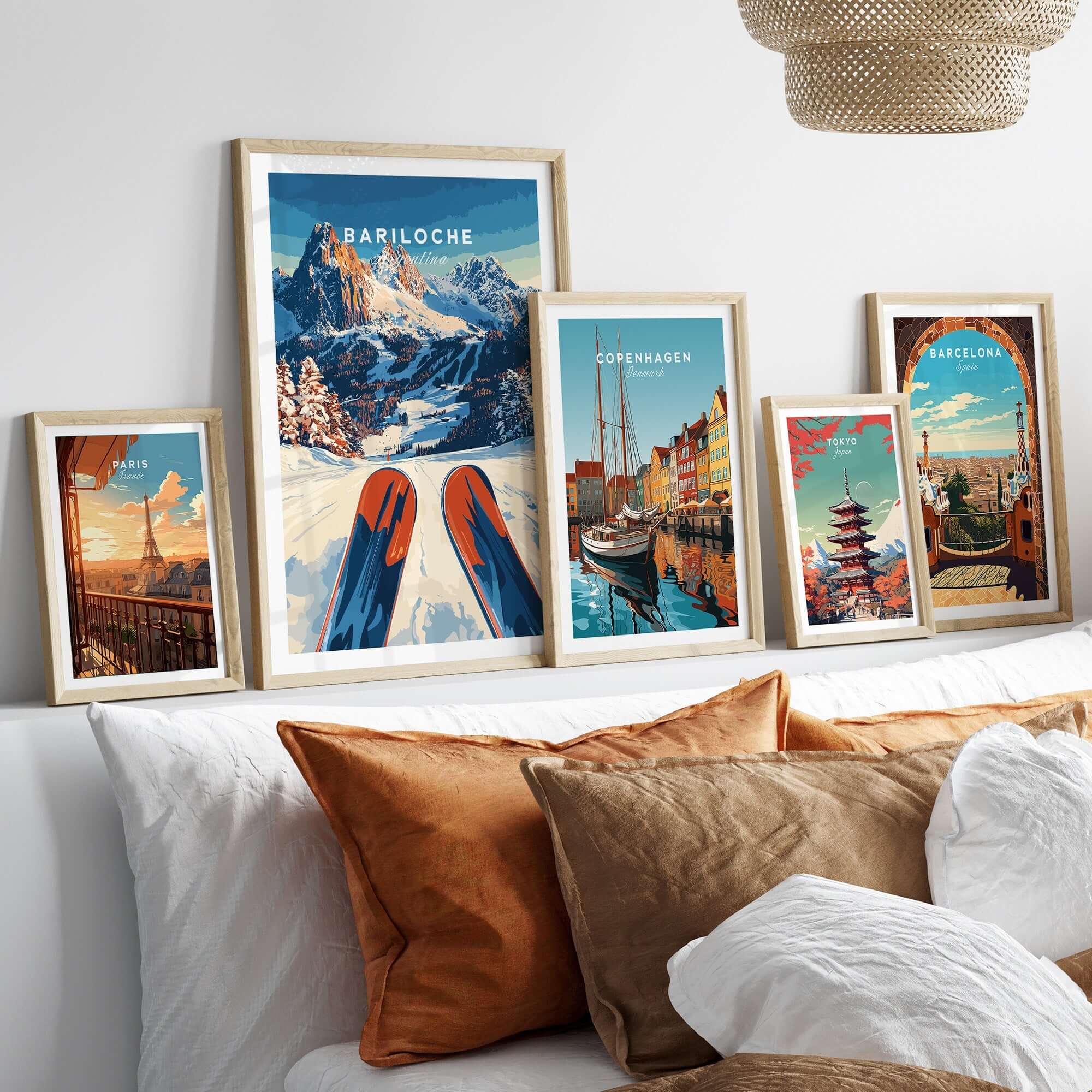 Bariloche Print Argentina showcased among other destination prints on a cozy sofa, highlighting adventure and beauty.