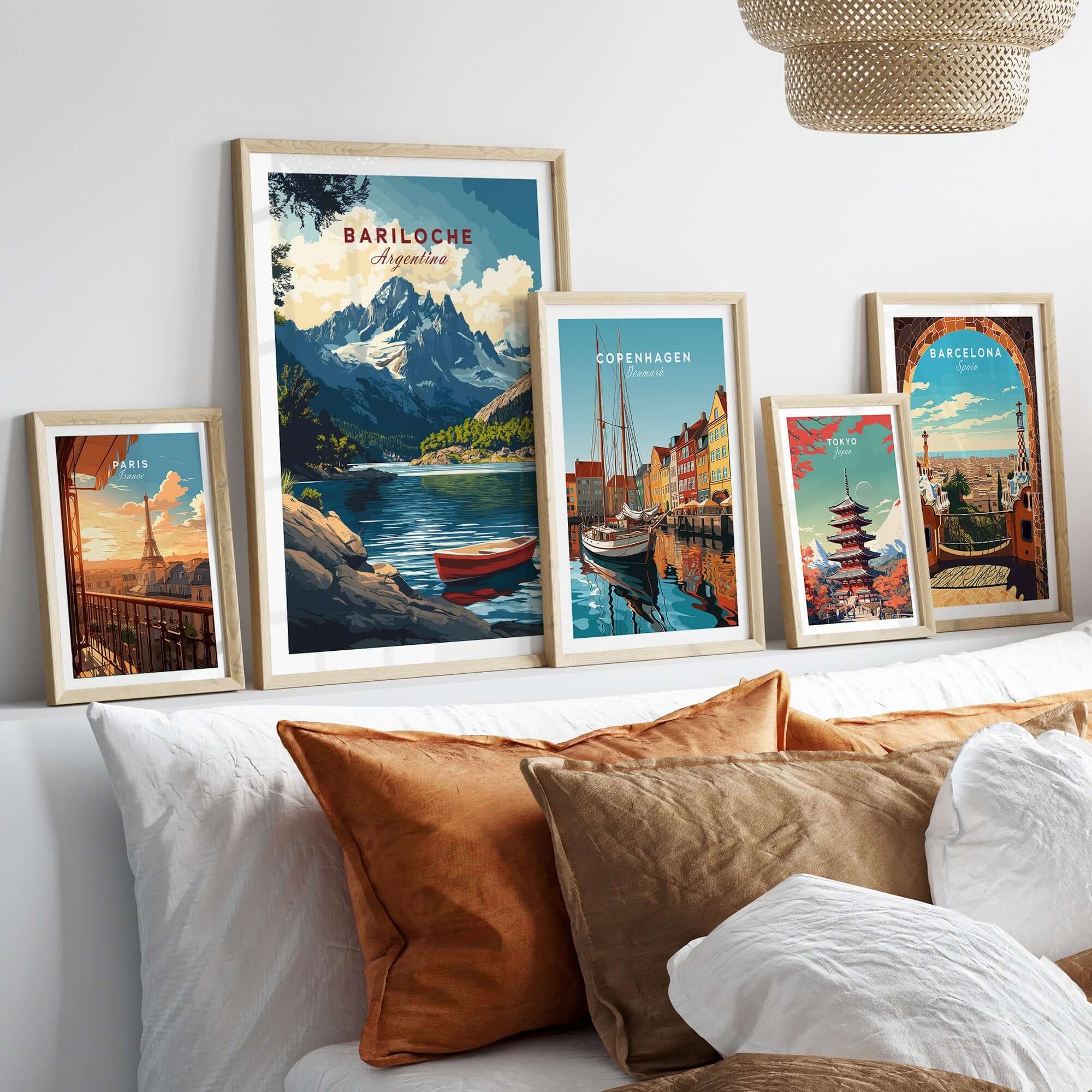 A display of Bariloche Wall Art showcasing vibrant landscapes and cityscapes in framed prints.