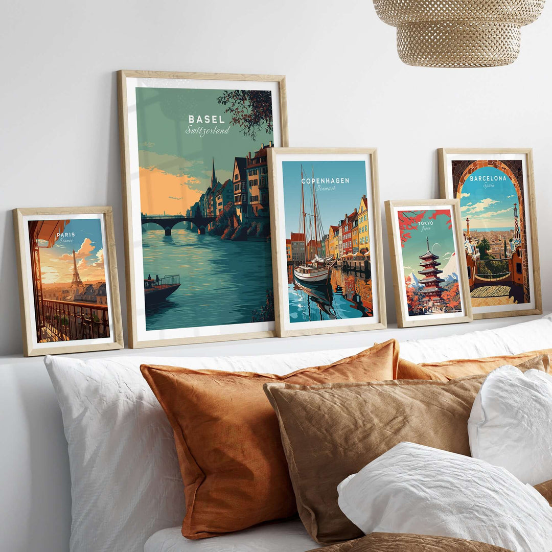 Basel Switzerland Old Town river view poster collection displayed on a cozy wall over a couch with cushions.