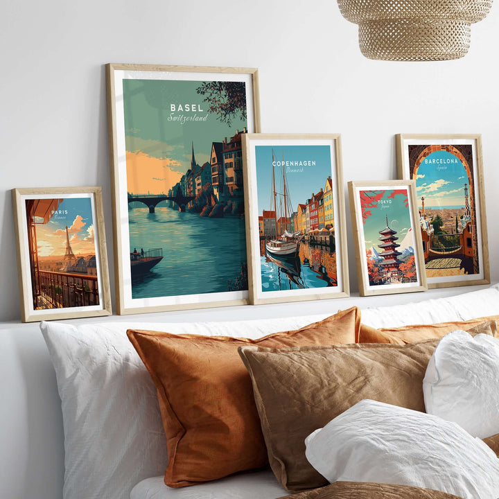 Basel Switzerland Old Town river view poster collection displayed on a cozy wall over a couch with cushions.