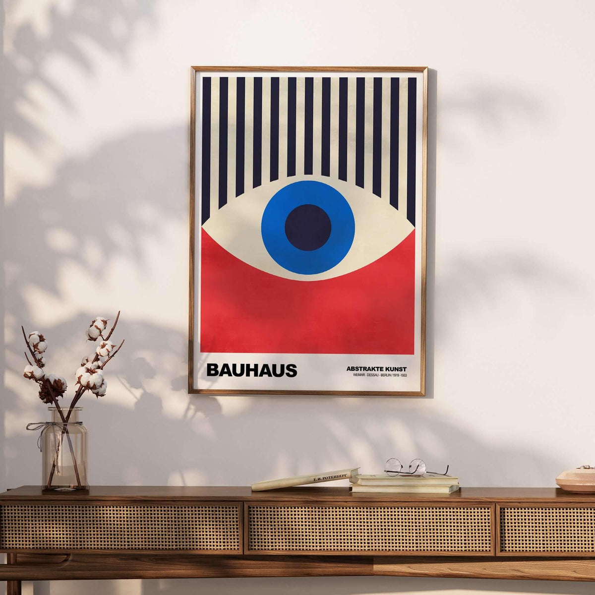 Bauhaus Exhibition Prints - Abstract Eye Art Print Geometric Red Blue Design displayed on a wall with a stylish wooden table.
