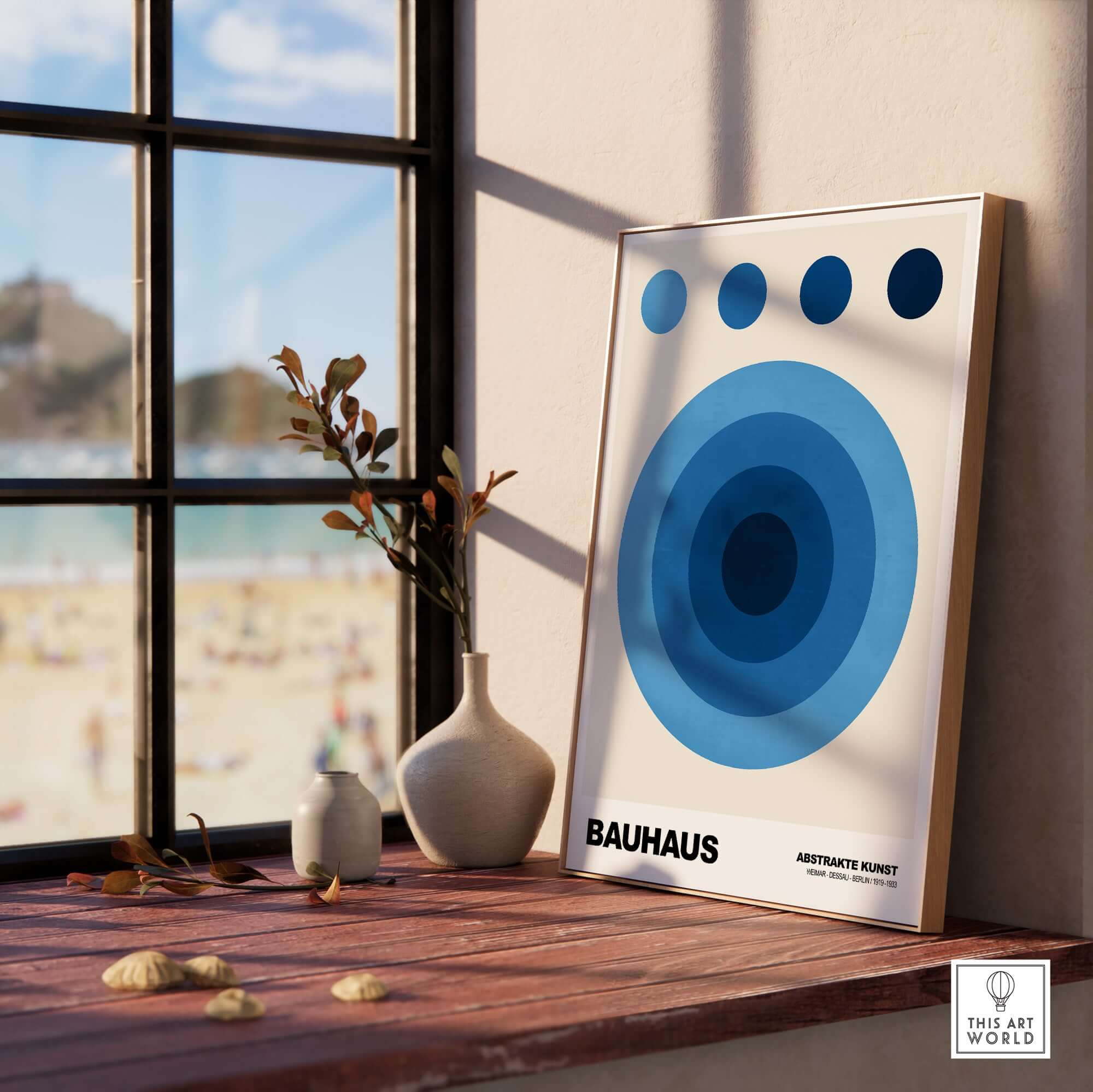 Bauhaus Exhibition Prints - Abstract Blue Circles Poster Geometric Design displayed by a window with beach view.