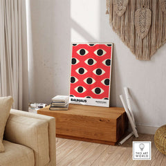 Bauhaus Exhibition Prints - Repeating Eyes Pattern Poster Red Black Cream Art displayed in modern home decor setting.