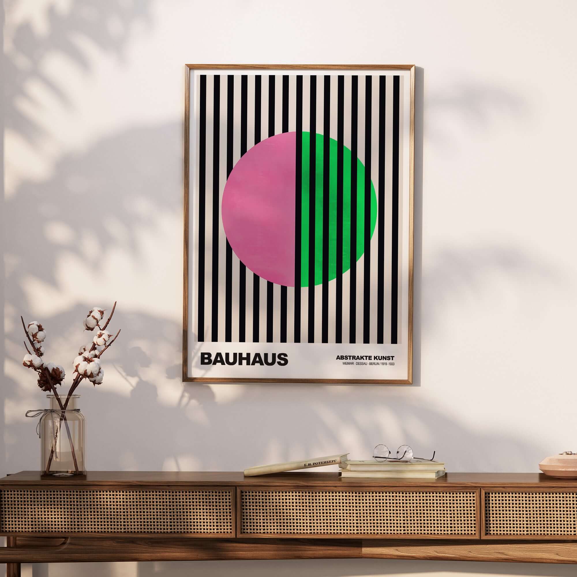 Bauhaus Exhibition Prints - Split Circle Abstract Art Print Pink Green Stripes displayed on a wall.