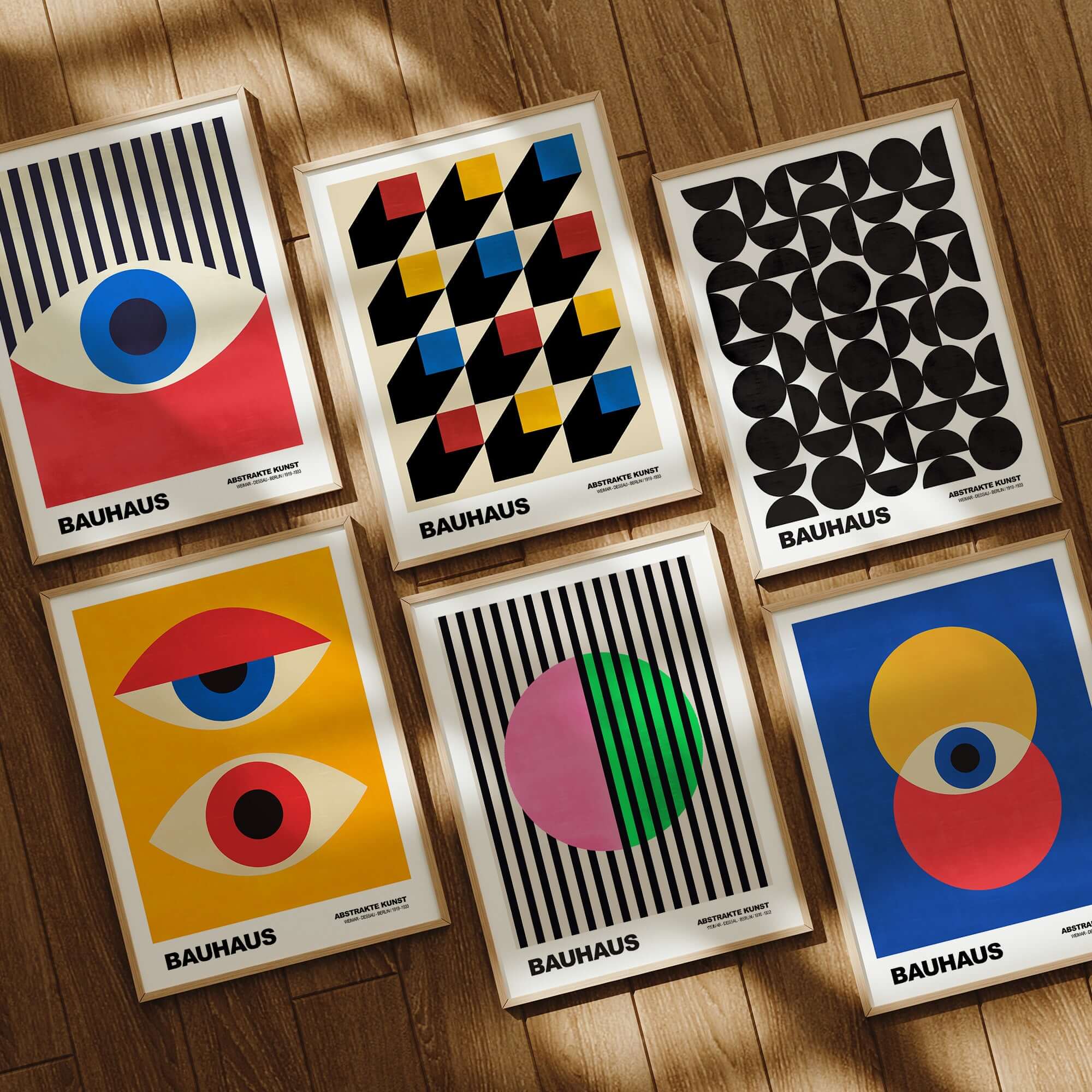 Bauhaus Exhibition Prints - Split Circle Abstract Art Print Pink Green Stripes displayed alongside other Bauhaus designs.