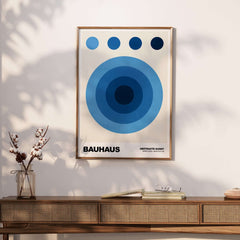 Bauhaus Exhibition Prints - Abstract Blue Circles Poster Geometric Design featuring concentric blue circles and a neutral background.