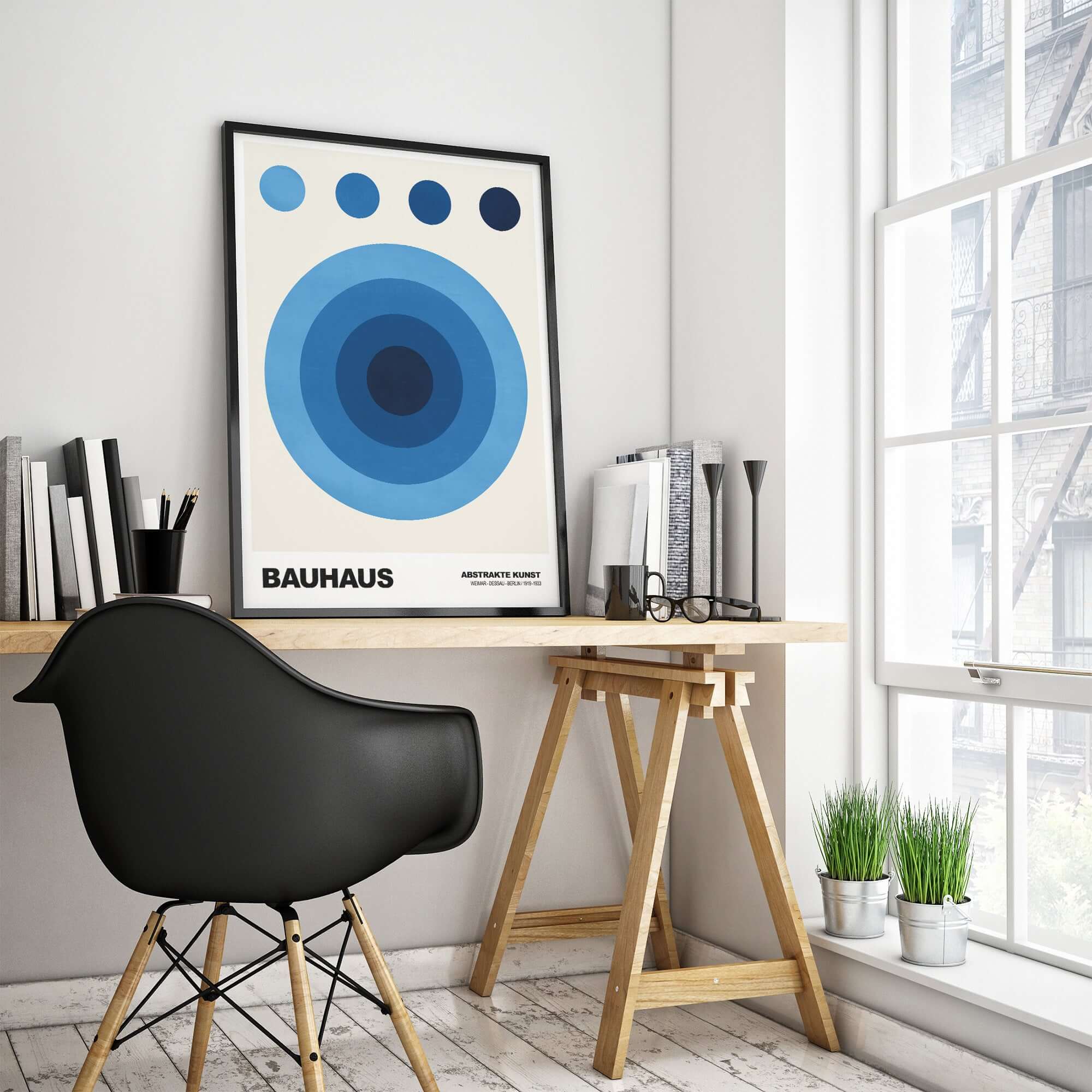 Bauhaus Exhibition Prints - Abstract Blue Circles Poster Geometric Design displayed in a modern workspace with a black chair.