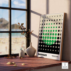 Bauhaus Exhibition Prints - Abstract Circle Pattern Art Print Green Black Dot Gradient displayed in a bright room by the window.