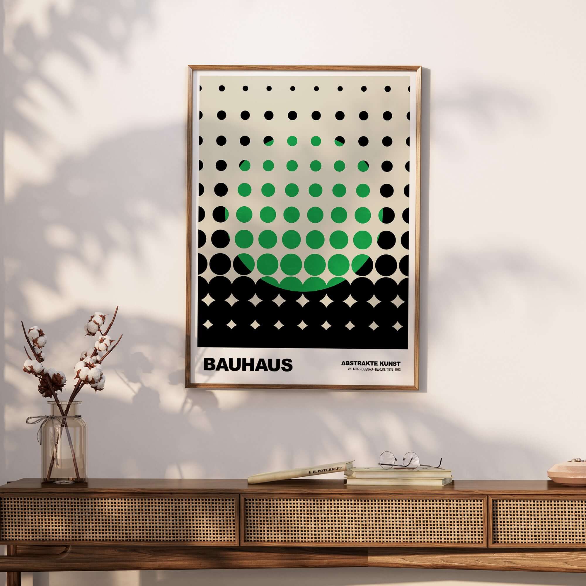 Bauhaus Exhibition Prints - Abstract Circle Pattern Art Print Green Black Dot Gradient framed on a wall with a wooden table.