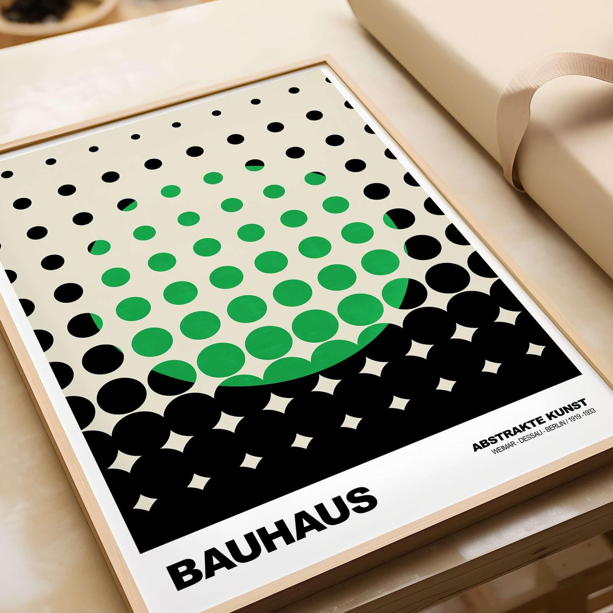 Bauhaus Exhibition Prints - Abstract Circle Pattern Art Print Green Black Dot Gradient displayed on a table.