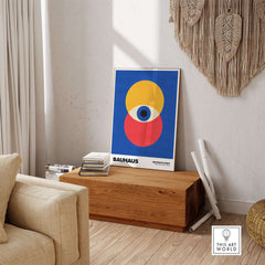 Bauhaus Exhibition Prints - Abstract Eye Circles Poster - Blue Yellow Red Primary Art displayed in a modern living room setting.