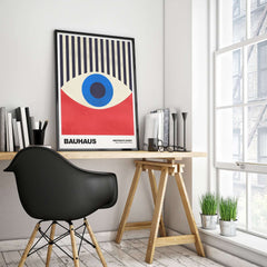 Bauhaus Exhibition Prints - Abstract Eye Art Print Geometric Red Blue Design displayed in a modern interior with a black chair.