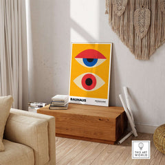 Bauhaus Exhibition Prints - Abstract Eyes Poster Geometric Orange Red Blue Art displayed in a modern interior.