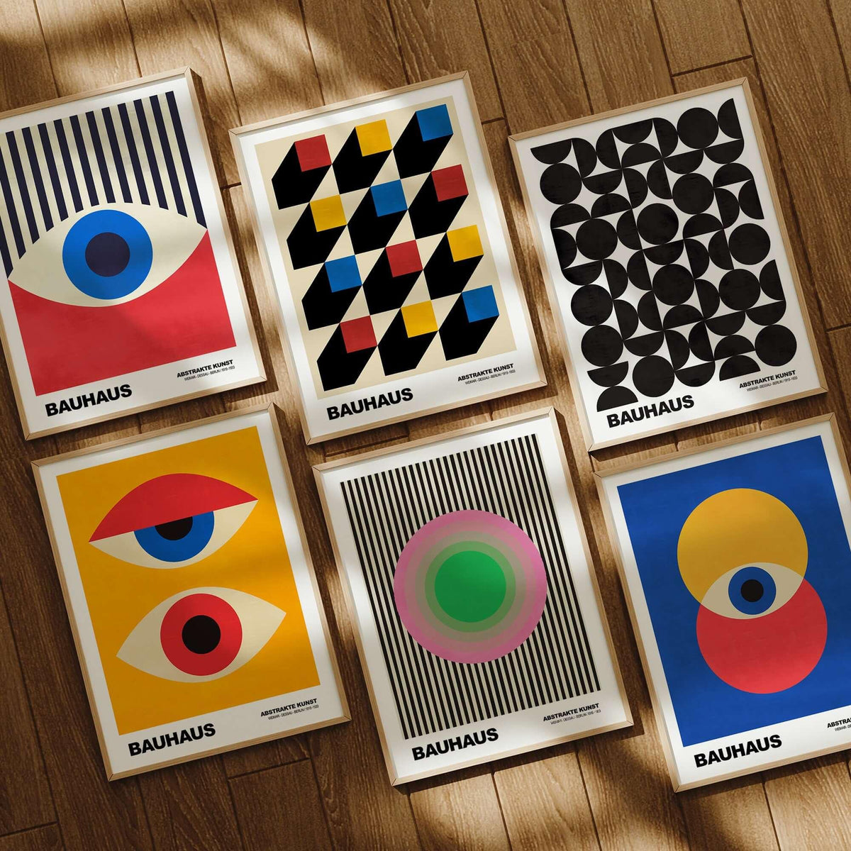 Bauhaus Exhibition Prints - Concentric Circles Poster Pink Green Striped Art displayed in a gallery setting with various designs.