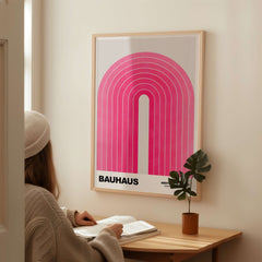Bauhaus Exhibition Prints - Concentric Pink Arch Poster Minimalist Geometric Art displayed in a cozy room setting.